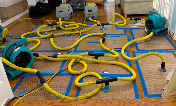 Professional Storm Water Damage Restoration technician working in Berlin, NH